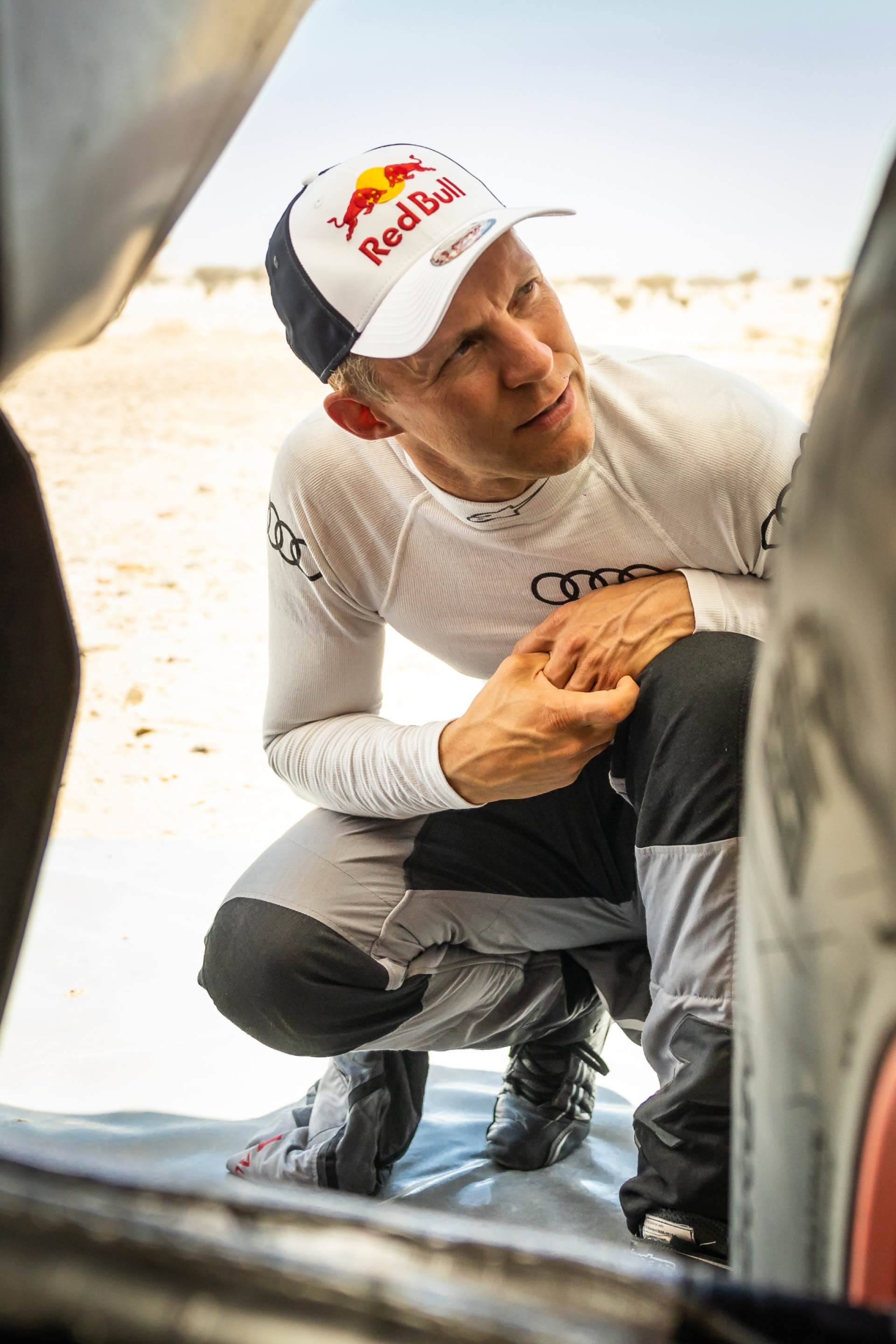 Mattias Ekström looking at a detail on the Audi RS Q e-tron.
